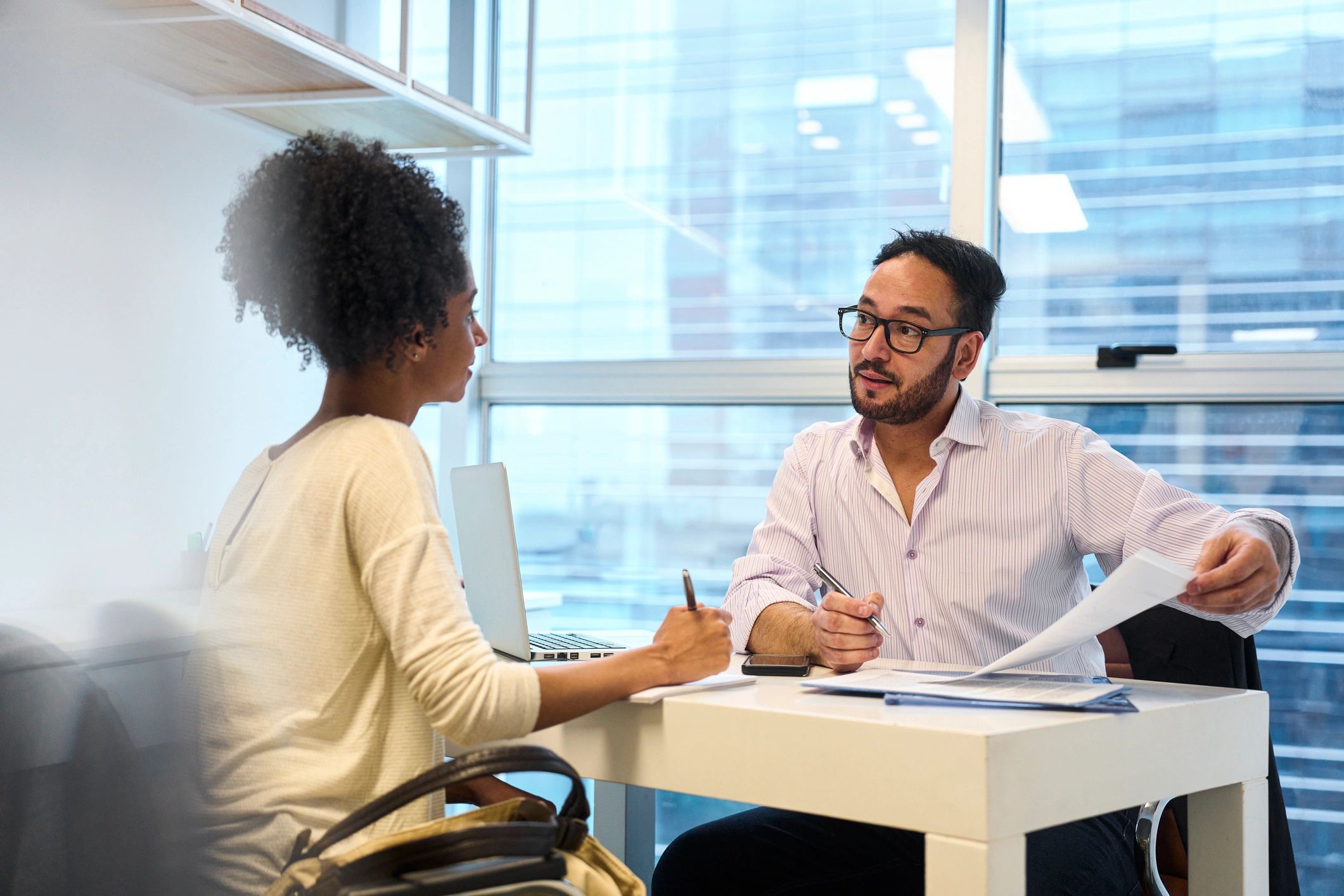 Attorney meeting with a client in a professional office